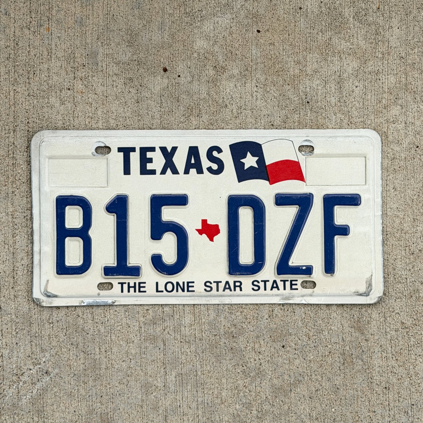 Photo of a 1990 Texas License Plate Auto Tag Garage Decor Vintage B15 DZF with original patina