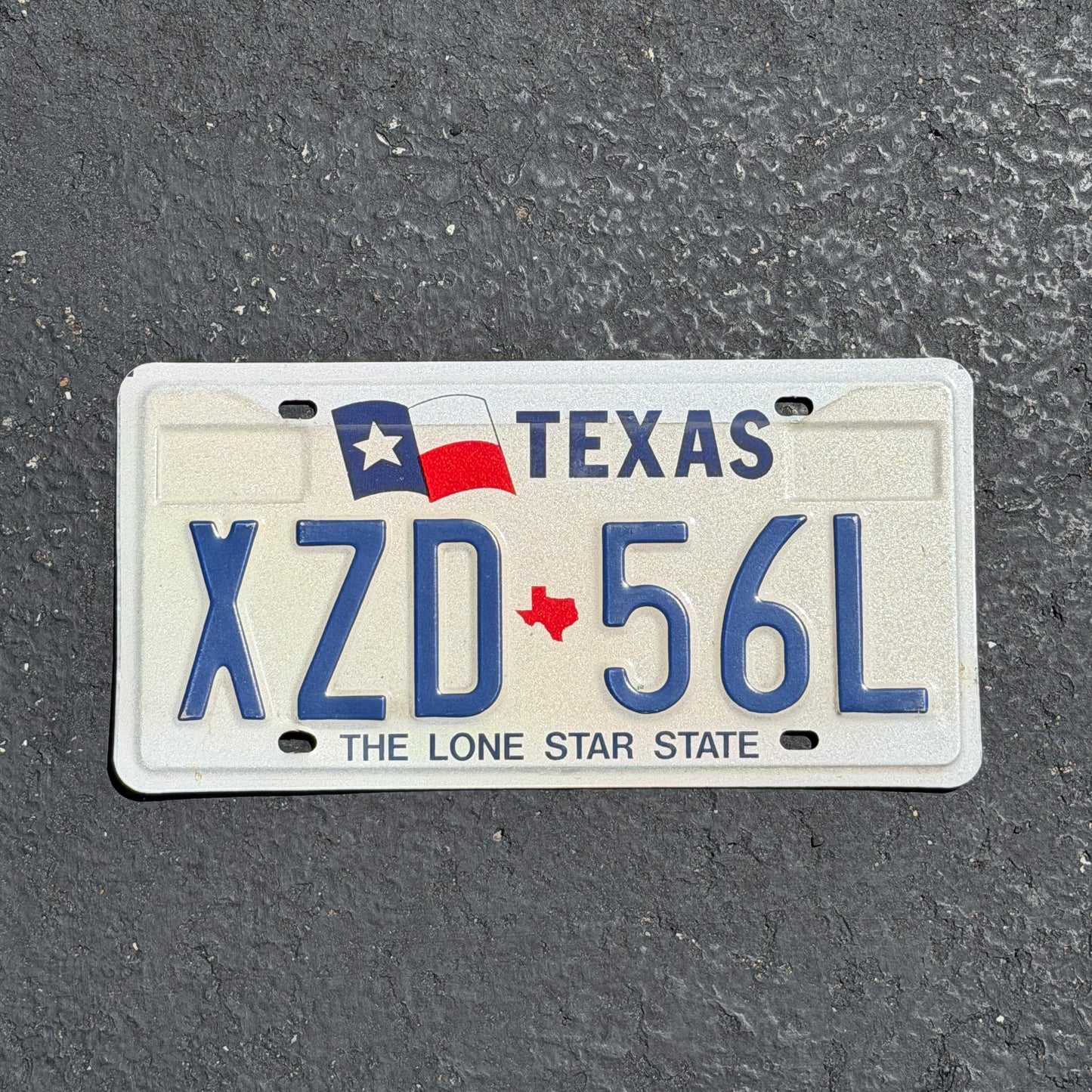Photo of a 1990 Texas License Plate Auto Tag Garage Decor Vintage XZD 56L with original patina