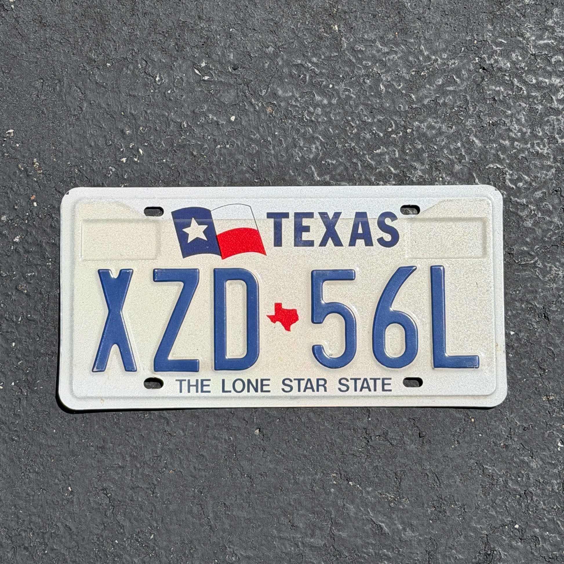 Photo of a 1990 Texas License Plate Auto Tag Garage Decor Vintage XZD 56L with original patina