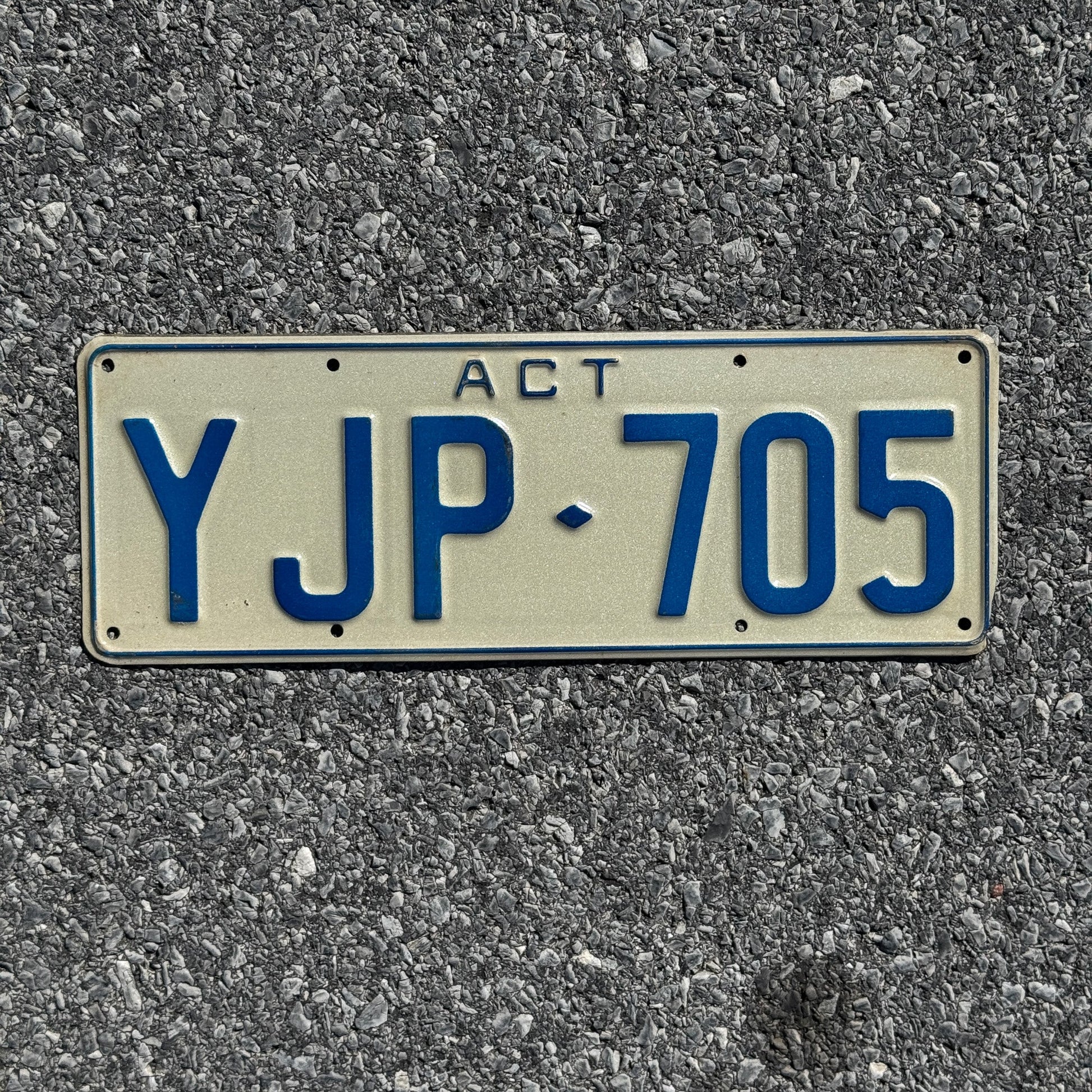Photo of a 1990s Era Australian Capital Territory License Plate Auto Tag Garage Decor Vintage YJP 705