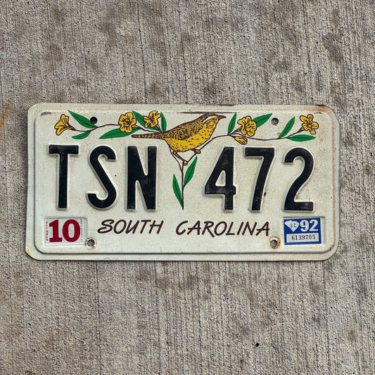 Photo of a 1991 1992 South Carolina License Plate Auto Tag Garage Decor Vintage Bird Floral Decorative TSN 472 with original patina