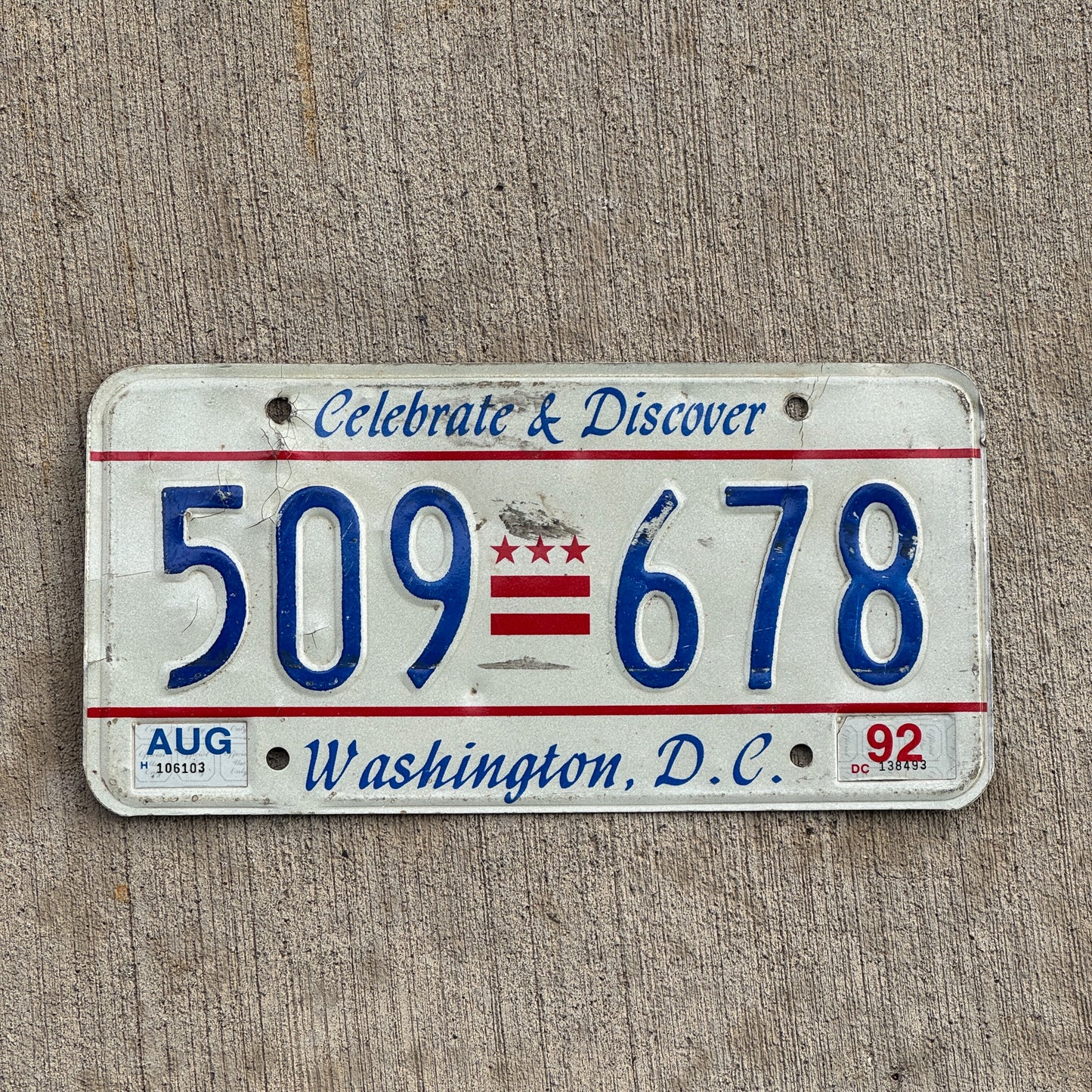 Photo of a 1991 1992 Washington DC License Plate Auto Tag Garage Decor Vintage Celebrate and Discover 509 678 with original patina