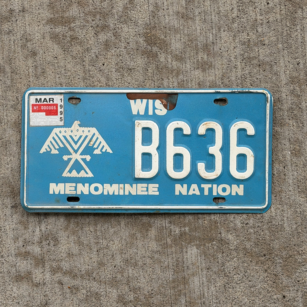 Photo of a 1991 1995 Wisconsin Graphic / Specialty License Plate Auto Tag Garage Decor Vintage Native American Indian Tribe Menominee Nation B 636 with original patina
