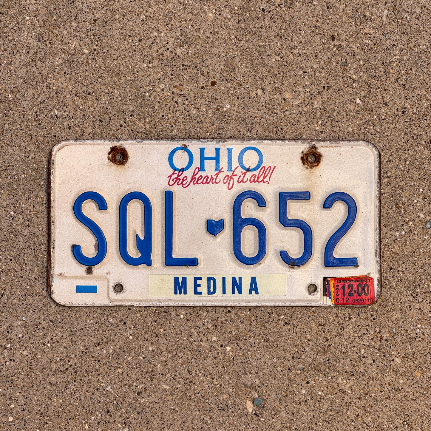 Photo of a 1991 2000 Ohio License Plate Auto Tag 1 Vintage Garage SQL 652 with original patina