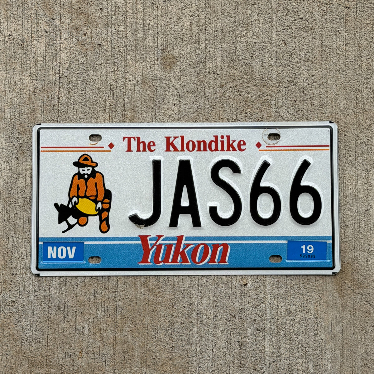 Photo of a 1991 2019 Yukon Vanity License Plate Auto Tag Garage Decor Vintage JAS 66 with original patina