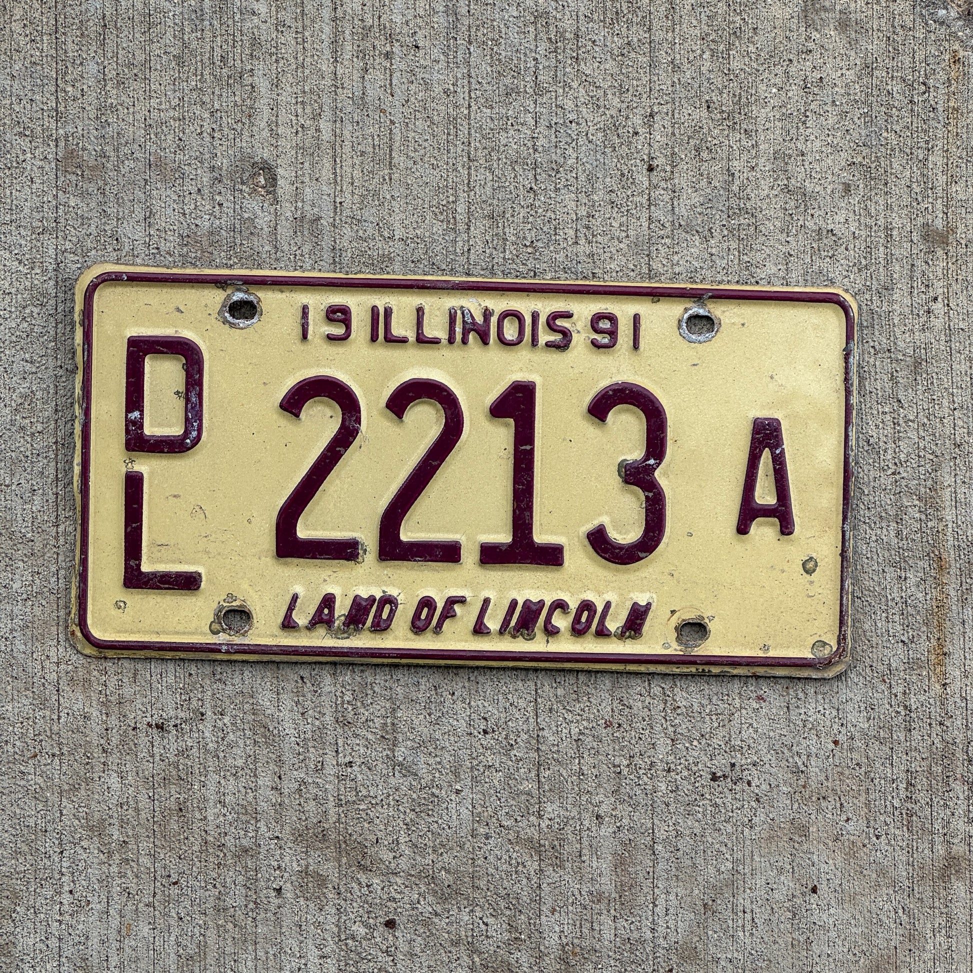 Photo of a 1991 Illinois Dealer License Plate Auto Tag 1 Vintage Garage 2213 A with original patina