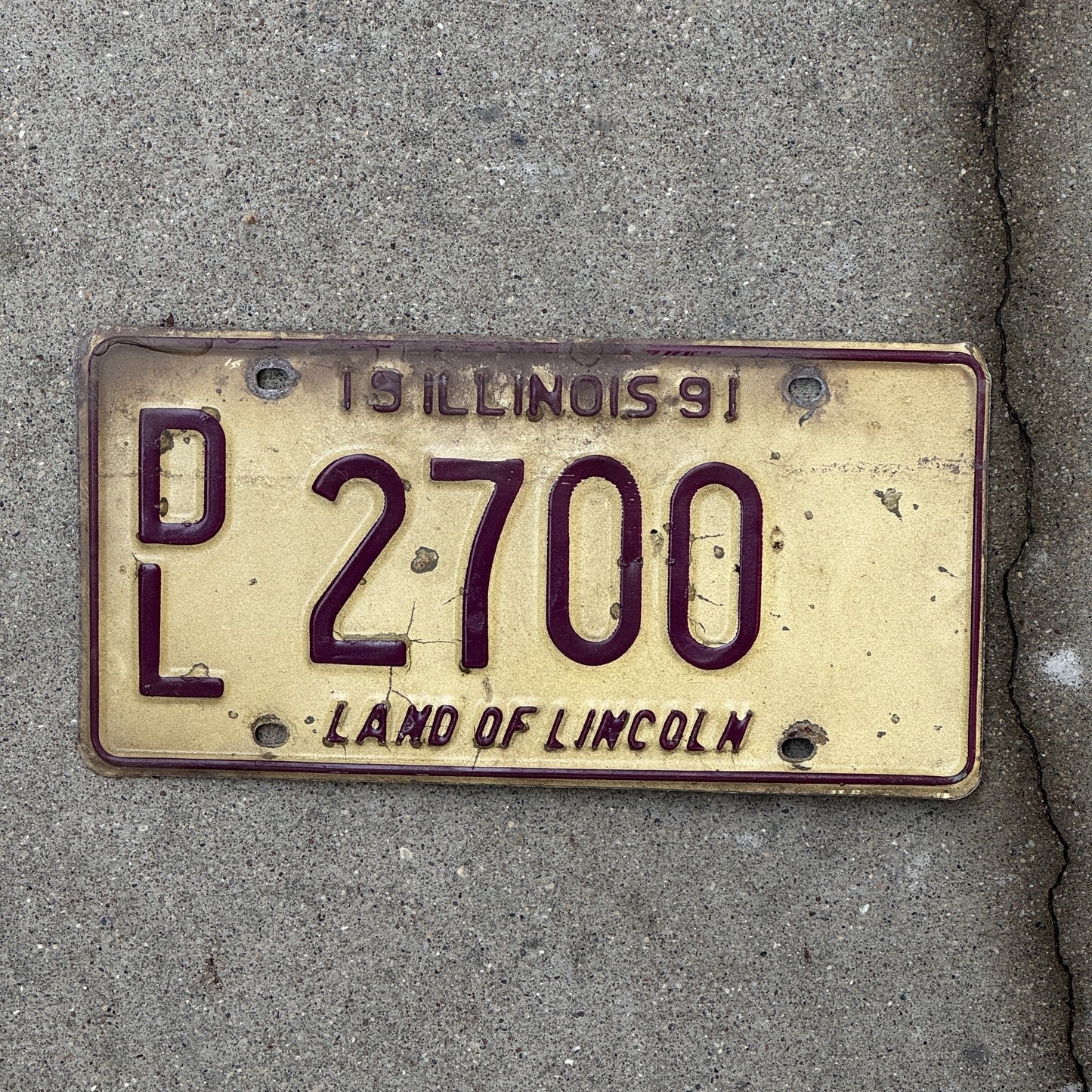 Photo of a 1991 Illinois Dealer License Plate Auto Tag 1 Vintage Garage 2700 with original patina