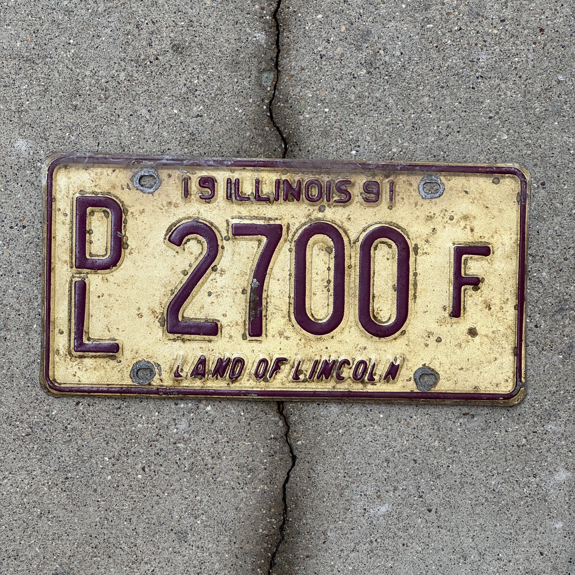 Photo of a 1991 Illinois Dealer License Plate Auto Tag 1 Vintage Garage 2700 F with original patina