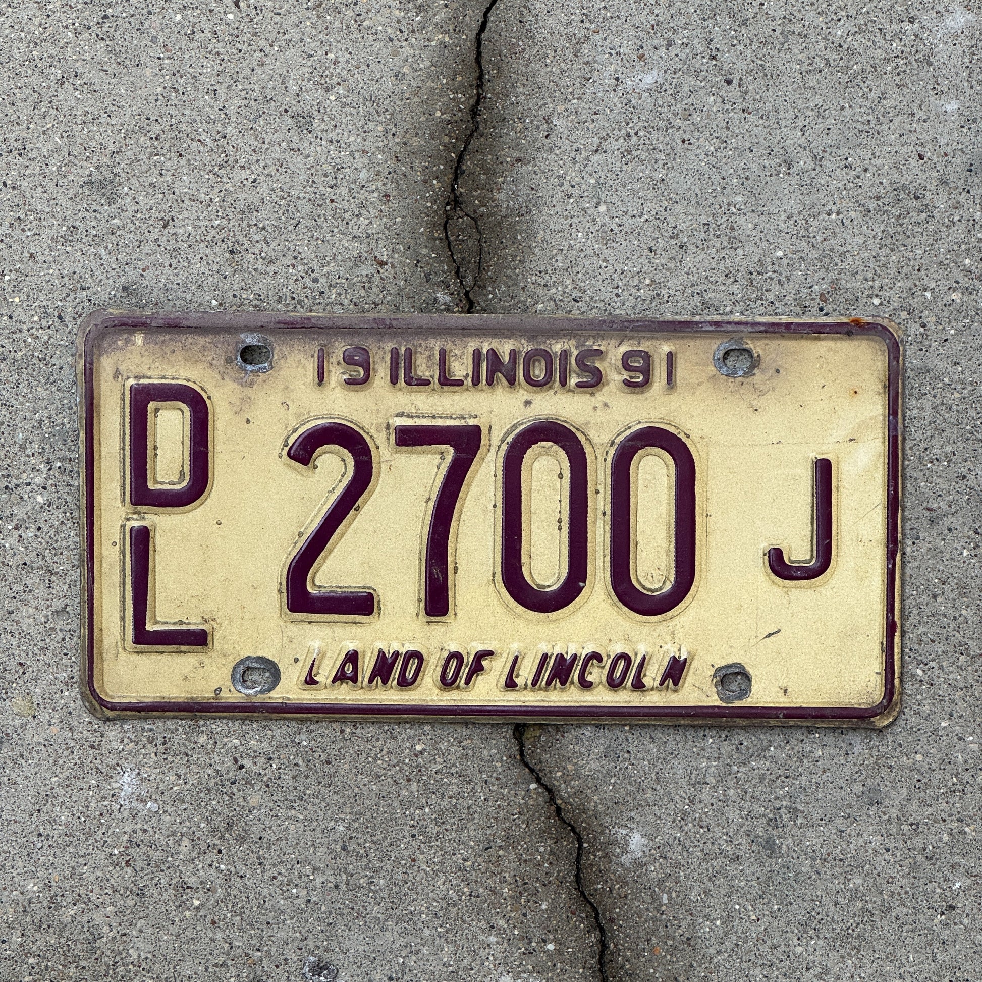Photo of a 1991 Illinois Dealer License Plate Auto Tag 1 Vintage Garage 2700 J with original patina
