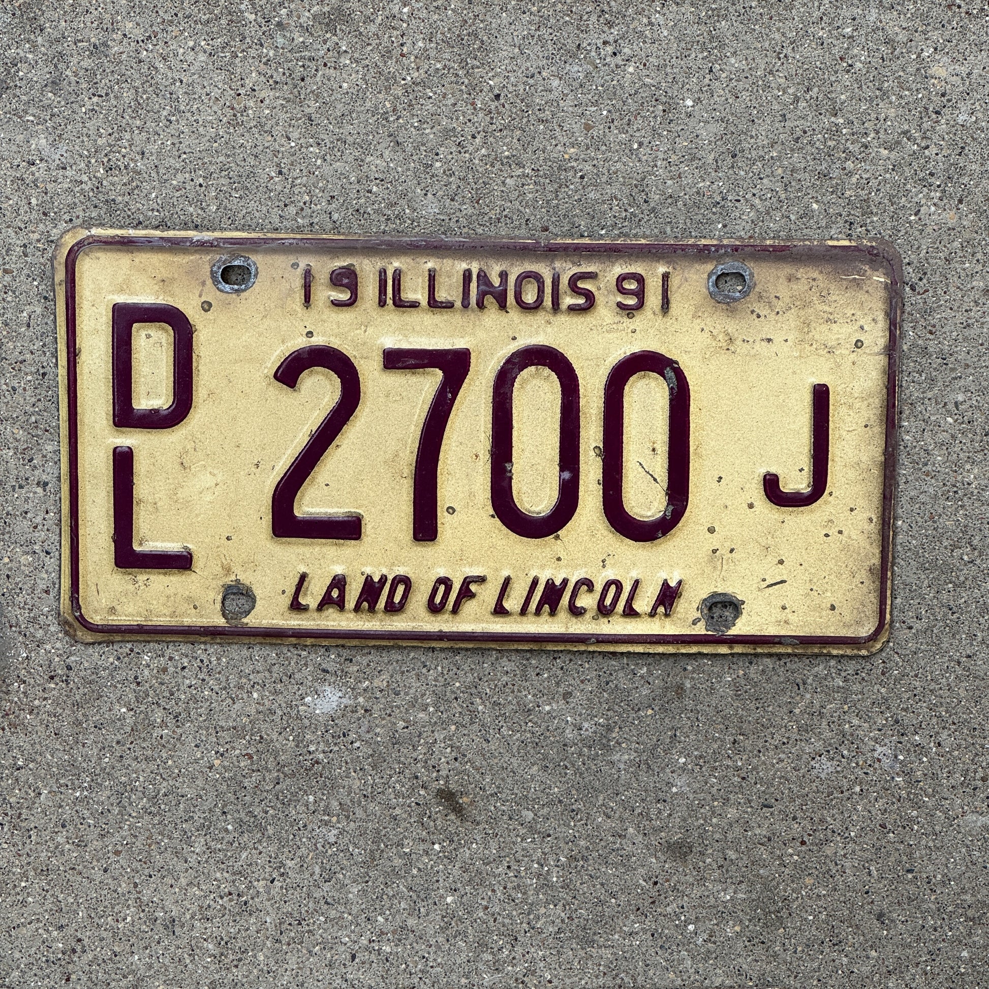 Photo of a 1991 Illinois Dealer License Plate Auto Tag 2 Vintage Garage 2700 J with original patina