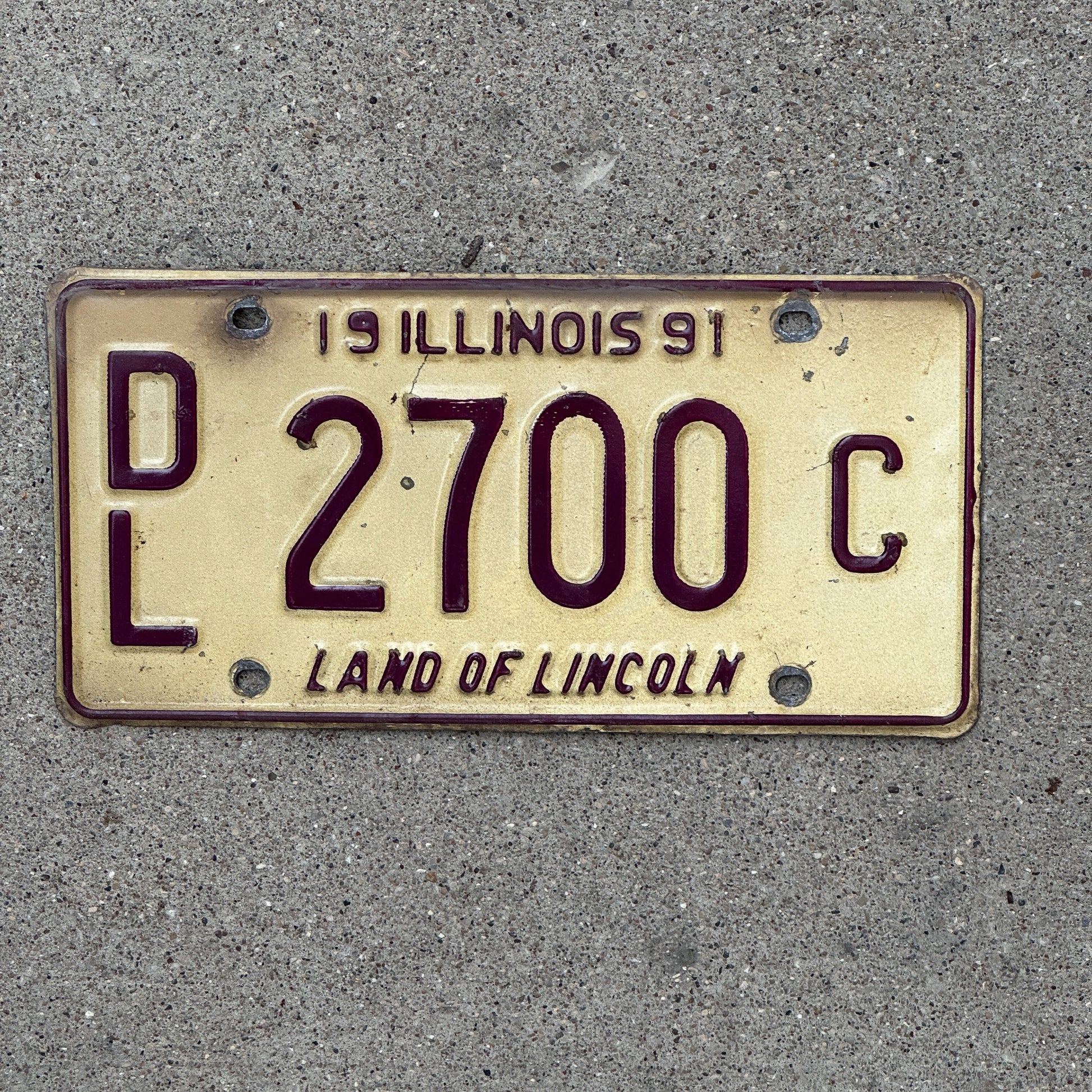 Photo of a 1991 Illinois Dealer License Plate Auto Tag Garage Decor Vintage 2700 C with original patina