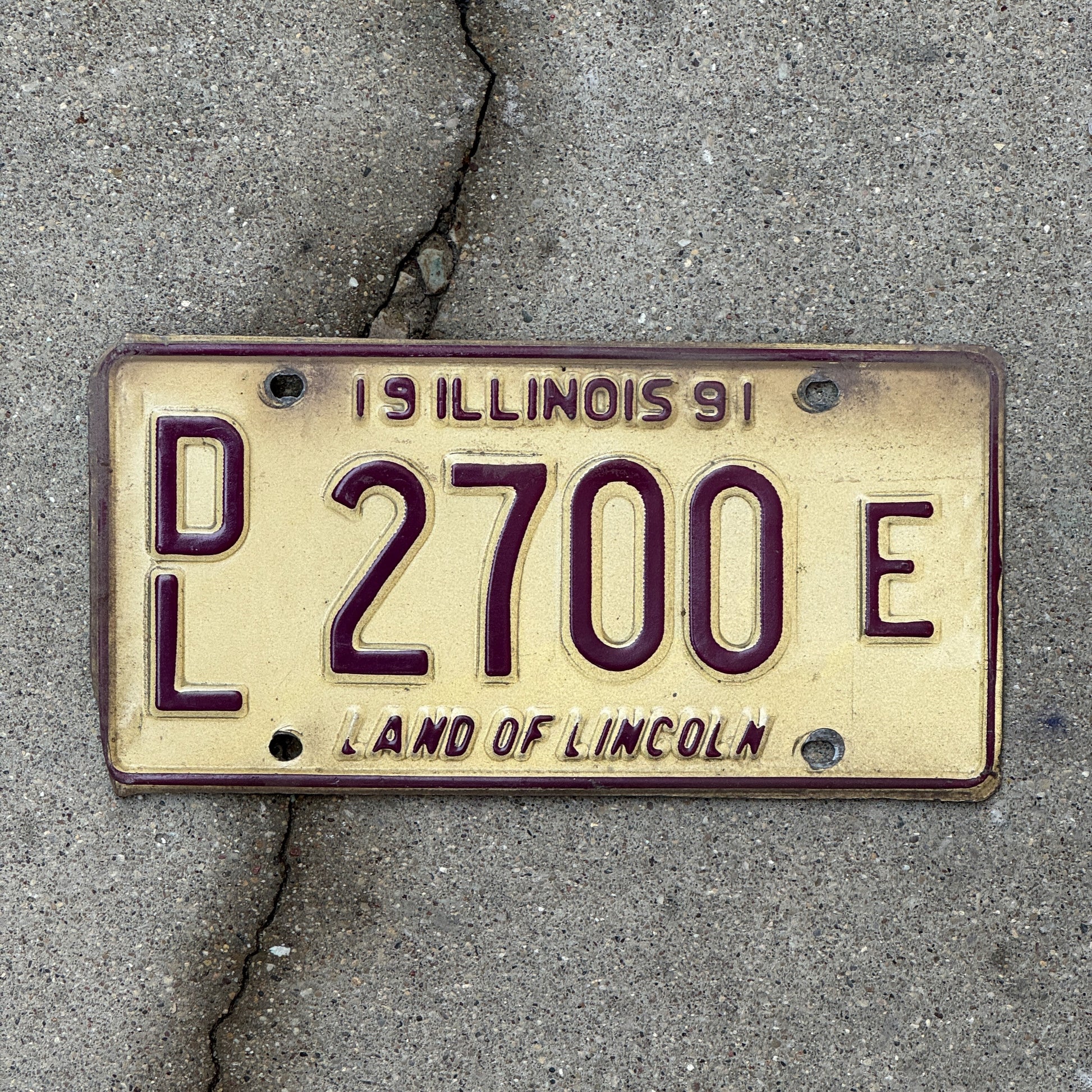 Photo of a 1991 Illinois Dealer License Plate Auto Tag Garage Decor Vintage 2700 E with original patina