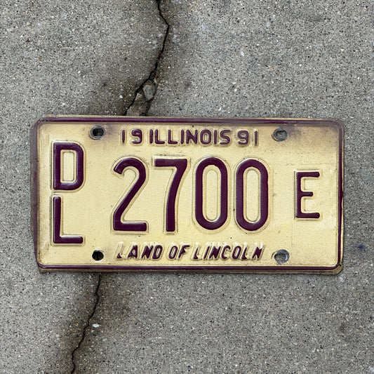 Photo of a 1991 Illinois Dealer License Plate Auto Tag Garage Decor Vintage 2700 E with original patina