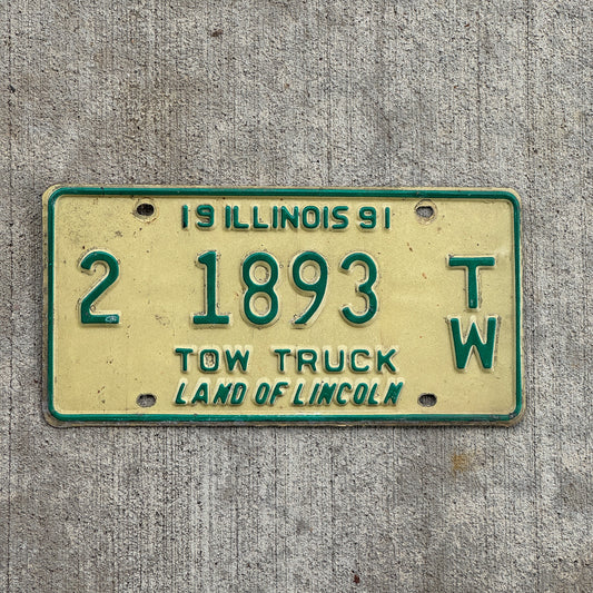 Photo of a 1991 Illinois Tow truck License Plate Auto Tag 1 Vintage Garage 2 1893 TW with original patina