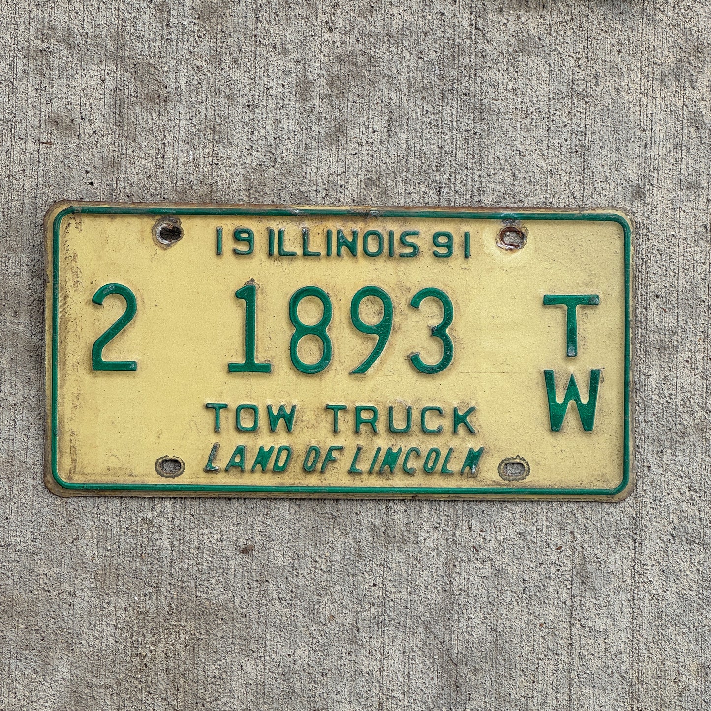 Photo of a 1991 Illinois Tow truck License Plate Auto Tag 2 Vintage Garage 2 1893 TW with original patina