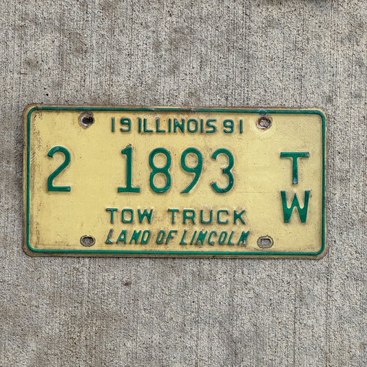 Photo of a 1991 Illinois Tow truck License Plate Auto Tag 2 Vintage Garage 2 1893 TW with original patina