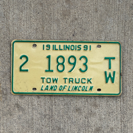 Photo of a 1991 Illinois Tow truck License Plate Auto Tag Garage Decor Vintage 2 1893 TW with original patina
