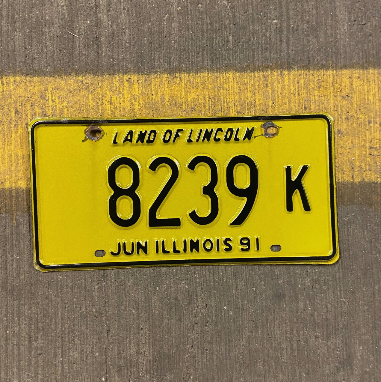 Photo of a 1991 Illinois Truck License Plate Auto Tag Garage Decor Vintage 8239 K with original patina
