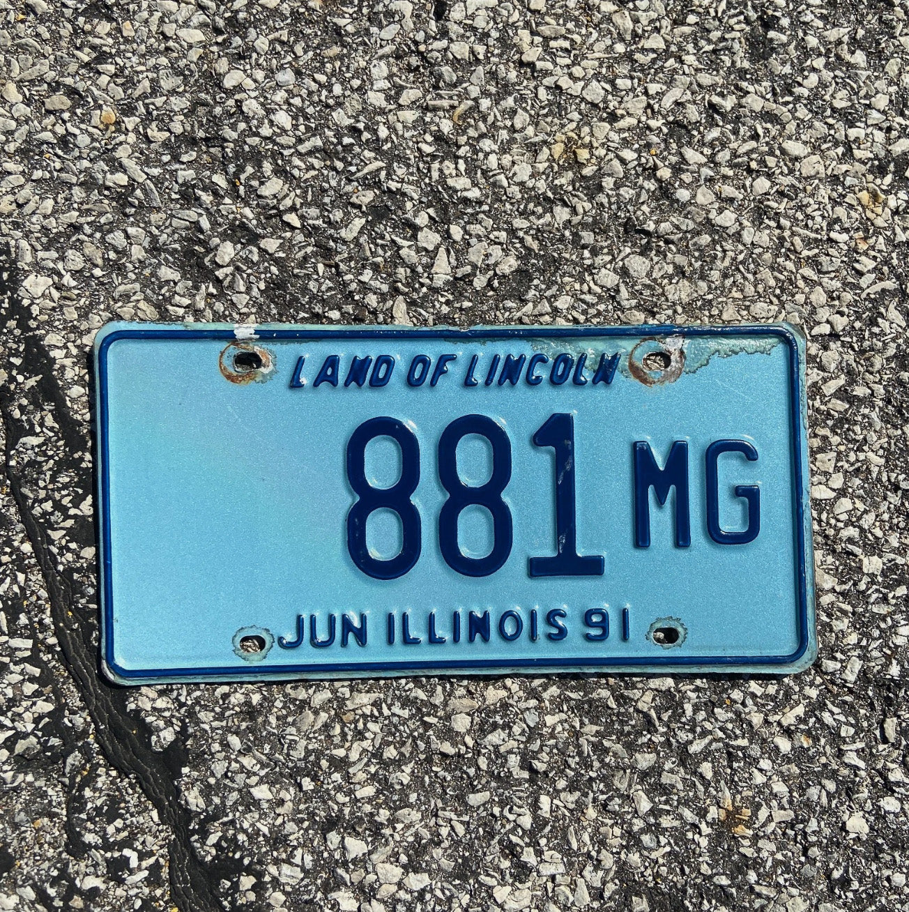 Photo of a 1991 Illinois Truck Mileage Tax License Plate Auto Tag Garage Decor Vintage Low Number 881 MG