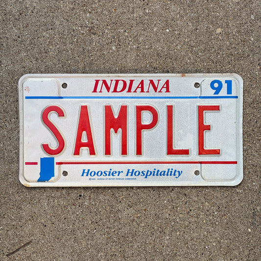 Photo of a 1991 Indiana Sample License Plate Auto Tag Garage Decor Vintage SAMPLE with original patina