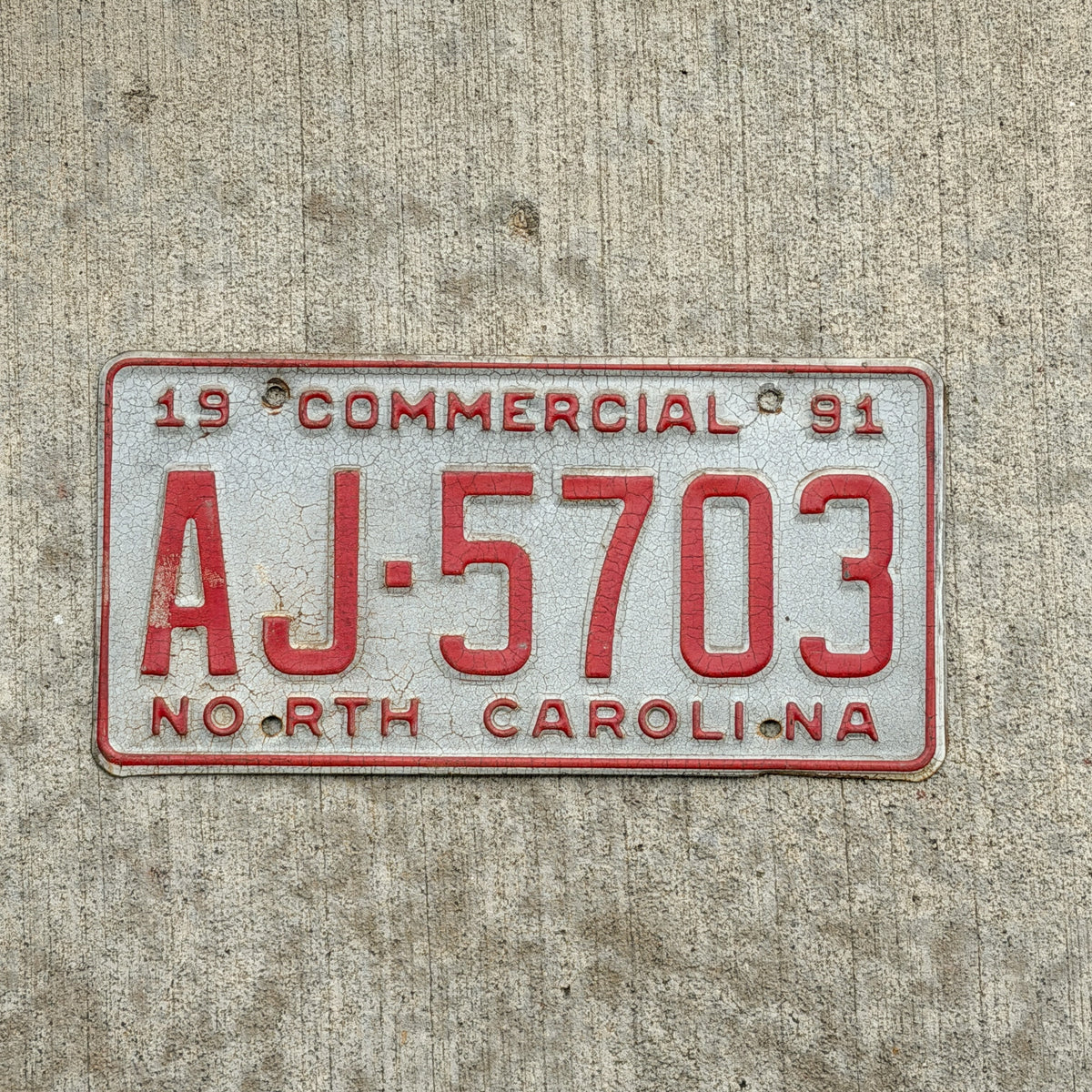 Photo of a 1991 North Carolina Commercial License Plate Auto Tag Garage Decor Vintage AJ 5703 with original patina