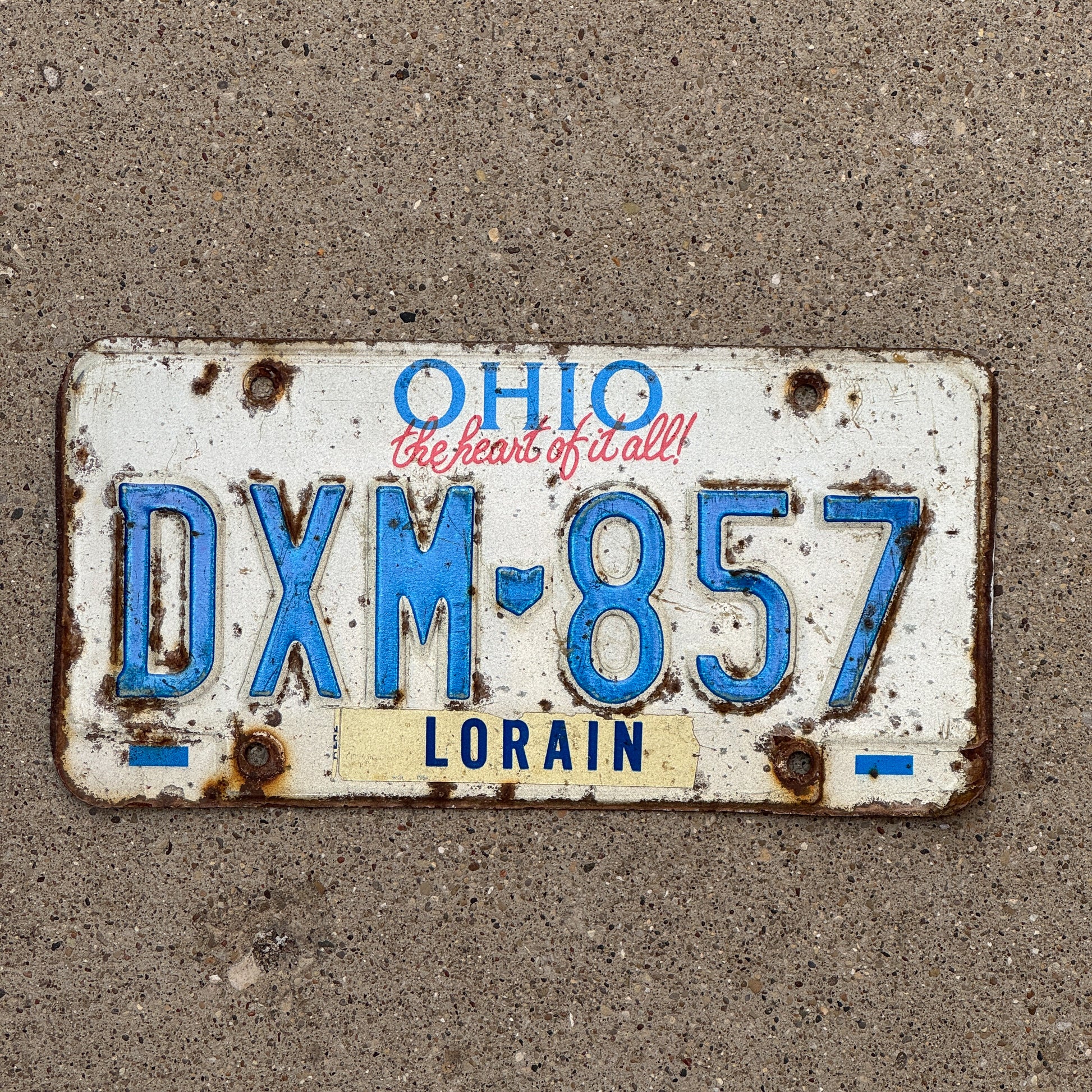 Photo of a 1991 Ohio License Plate Auto Tag 2 Vintage Garage DXM 857 with original patina