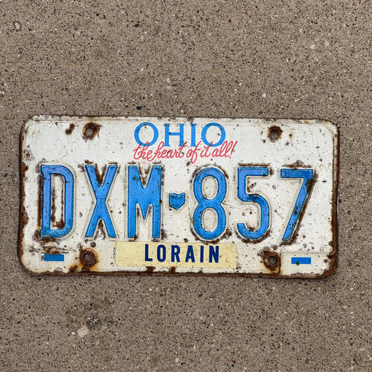Photo of a 1991 Ohio License Plate Auto Tag 2 Vintage Garage DXM 857 with original patina