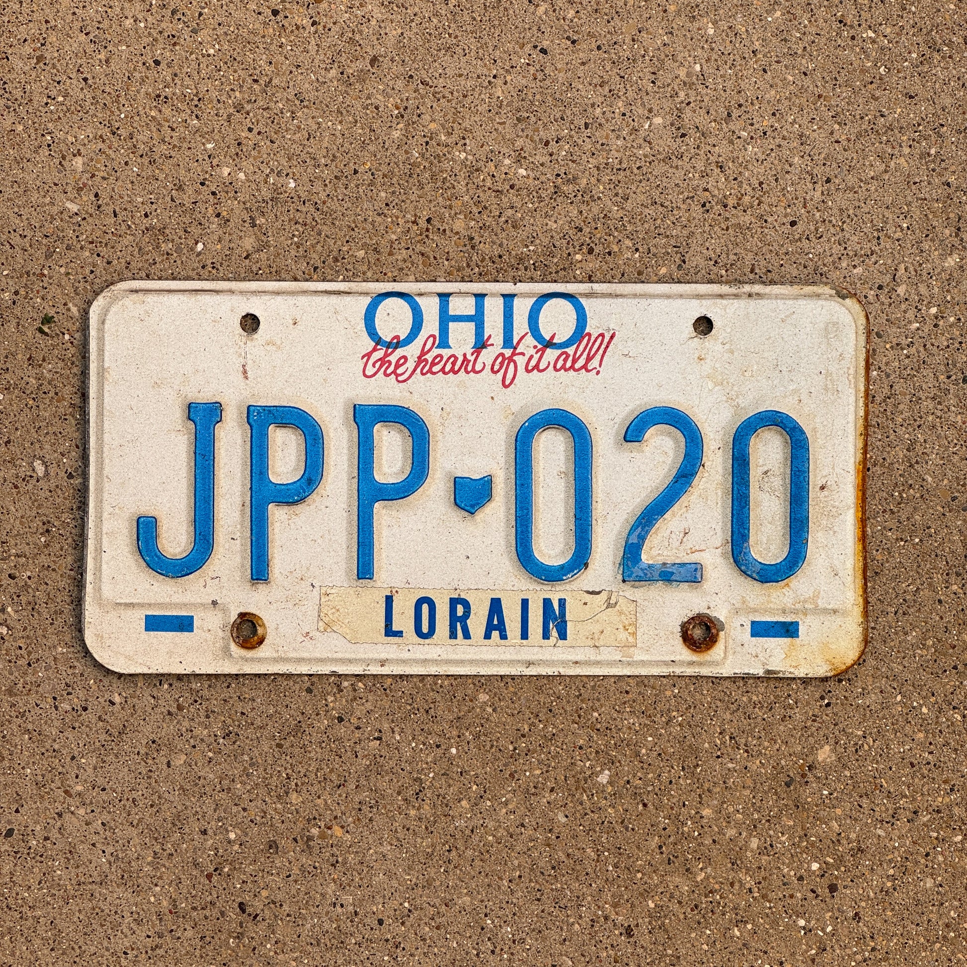 Photo of a 1991 Ohio License Plate Auto Tag 2 Vintage Garage JPP 020 with original patina