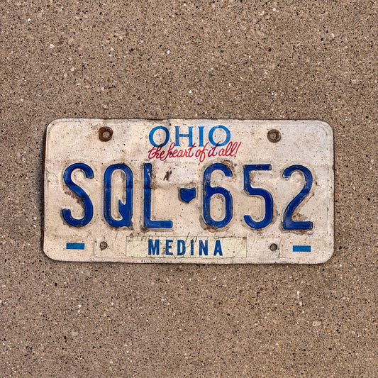 Photo of a 1991 Ohio License Plate Auto Tag 2 Vintage Garage SQL 652 with original patina