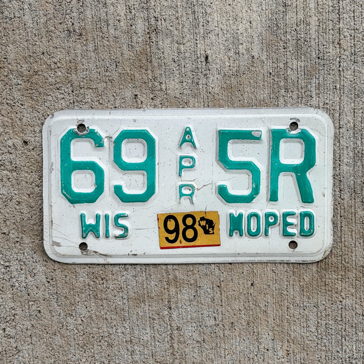 Photo of a 1992 1998 Wisconsin Moped License Plate Auto Tag Garage Decor Vintage 69 5R with original patina