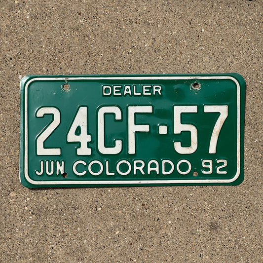 Photo of a 1992 Colorado Dealer License Plate Auto Tag Garage Decor Vintage 24 CF 57