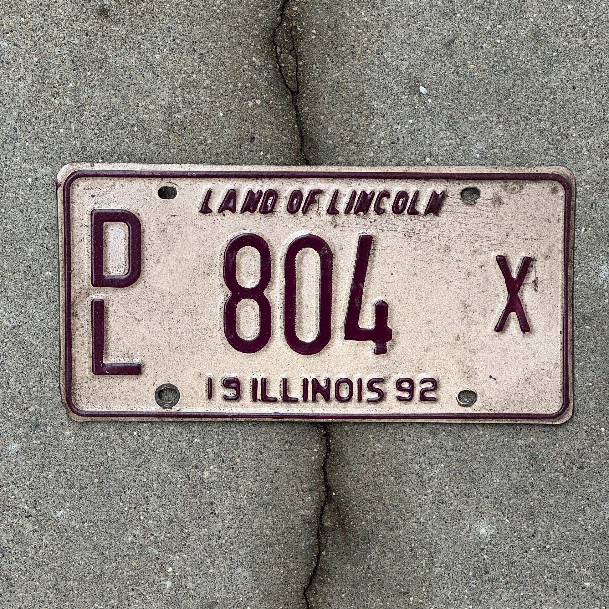 Photo of a 1992 Illinois Dealer License Plate Auto Tag 1 Vintage Garage 804 X with original patina
