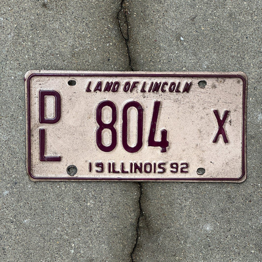 Photo of a 1992 Illinois Dealer License Plate Auto Tag 1 Vintage Garage 804 X with original patina