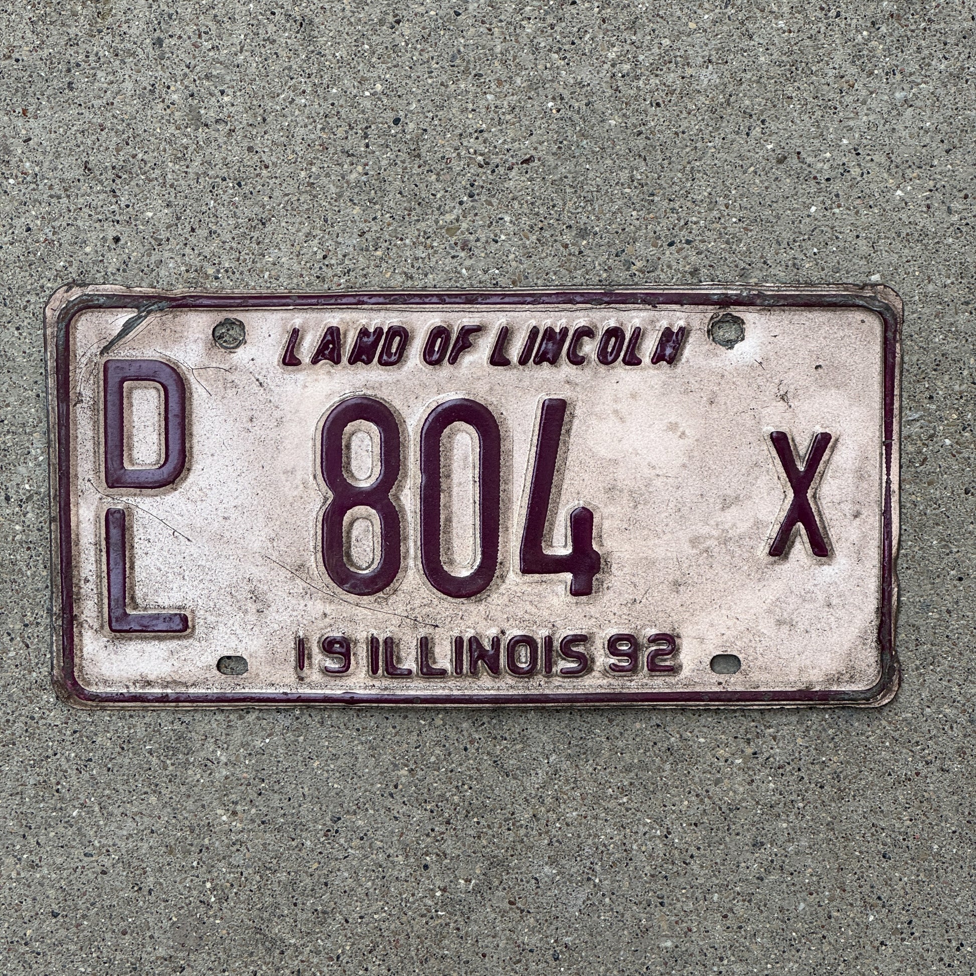 Photo of a 1992 Illinois Dealer License Plate Auto Tag 2 Vintage Garage 804 X with original patina