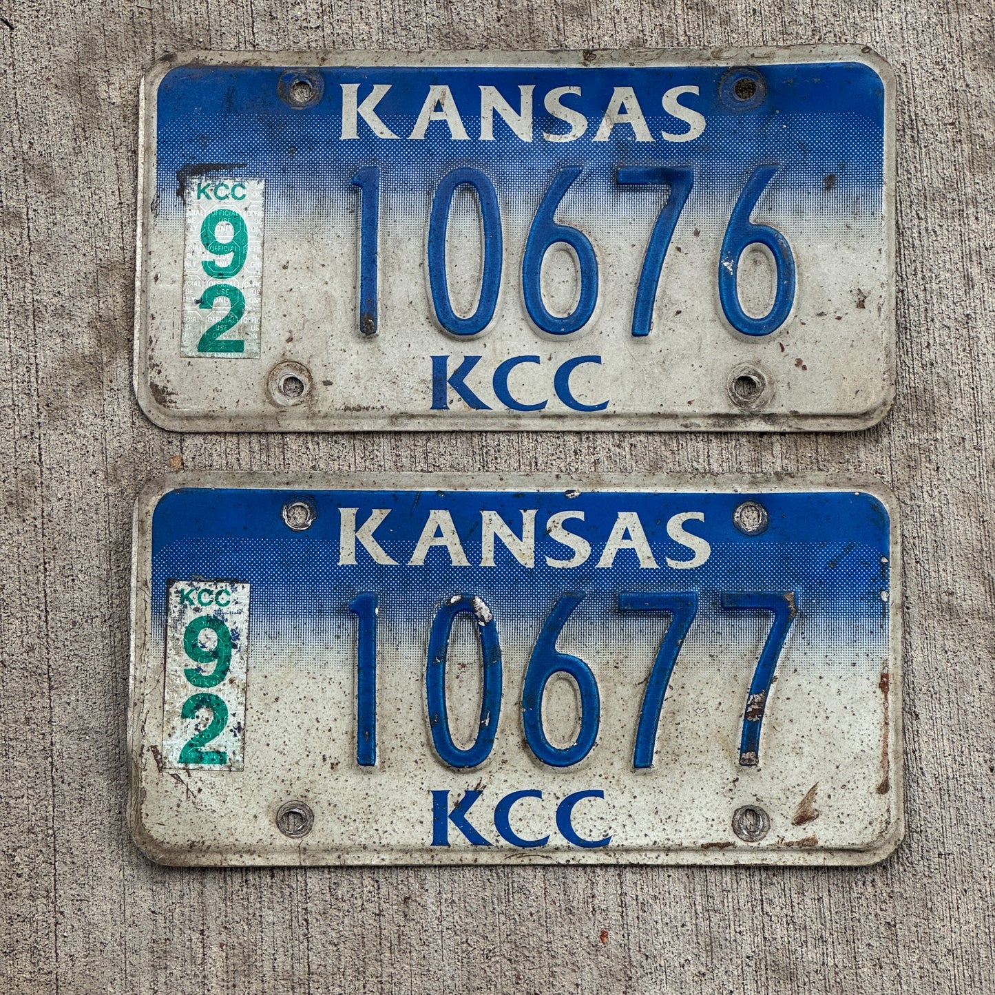 Photo of a 1992 Kansas Corporation Commission License Plate Pair Auto Tag Garage Decor Vintage 10676 with original patina