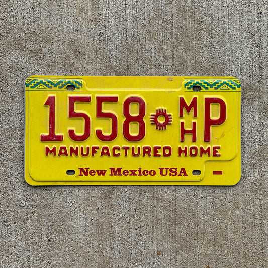 Photo of a 1992 New Mexico Manufactured home License Plate Auto Tag Garage Decor Vintage 1558 MH P with original patina
