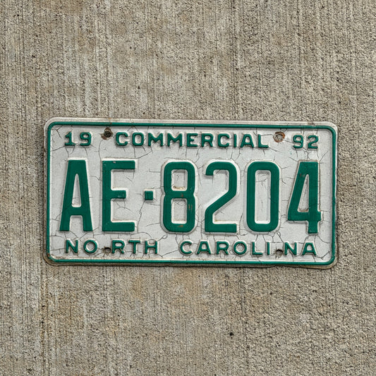 Photo of a 1992 North Carolina Commercial License Plate Auto Tag Garage Decor Vintage AE 8204 with original patina