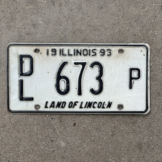 Photo of a 1993 Illinois Dealer License Plate Auto Tag 1 Vintage Garage Merritt's Sterling Ford Mercury Lincoln Dealer 673 P with original patina