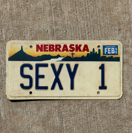 Nebraska license plate with 'SEXY 1' on a textured surface