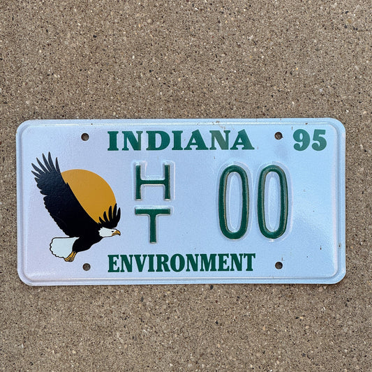 Photo of a 1994 1995 Indiana Graphic Sample License Plate Auto Tag Garage Decor Vintage Environment Bald Eagle HT 00 with original patina