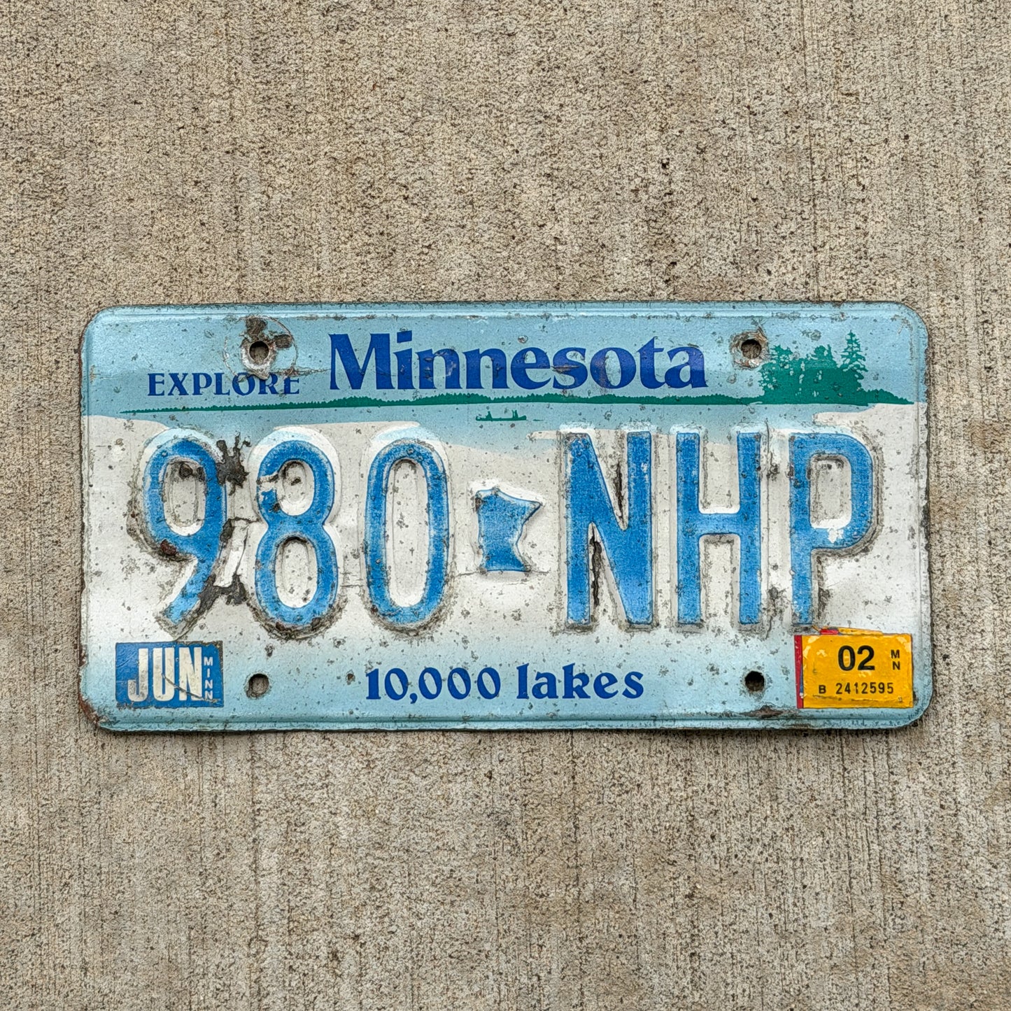 Photo of a 1994 2002 Minnesota License Plate Auto Tag Garage Decor Vintage 980 NHP with original patina