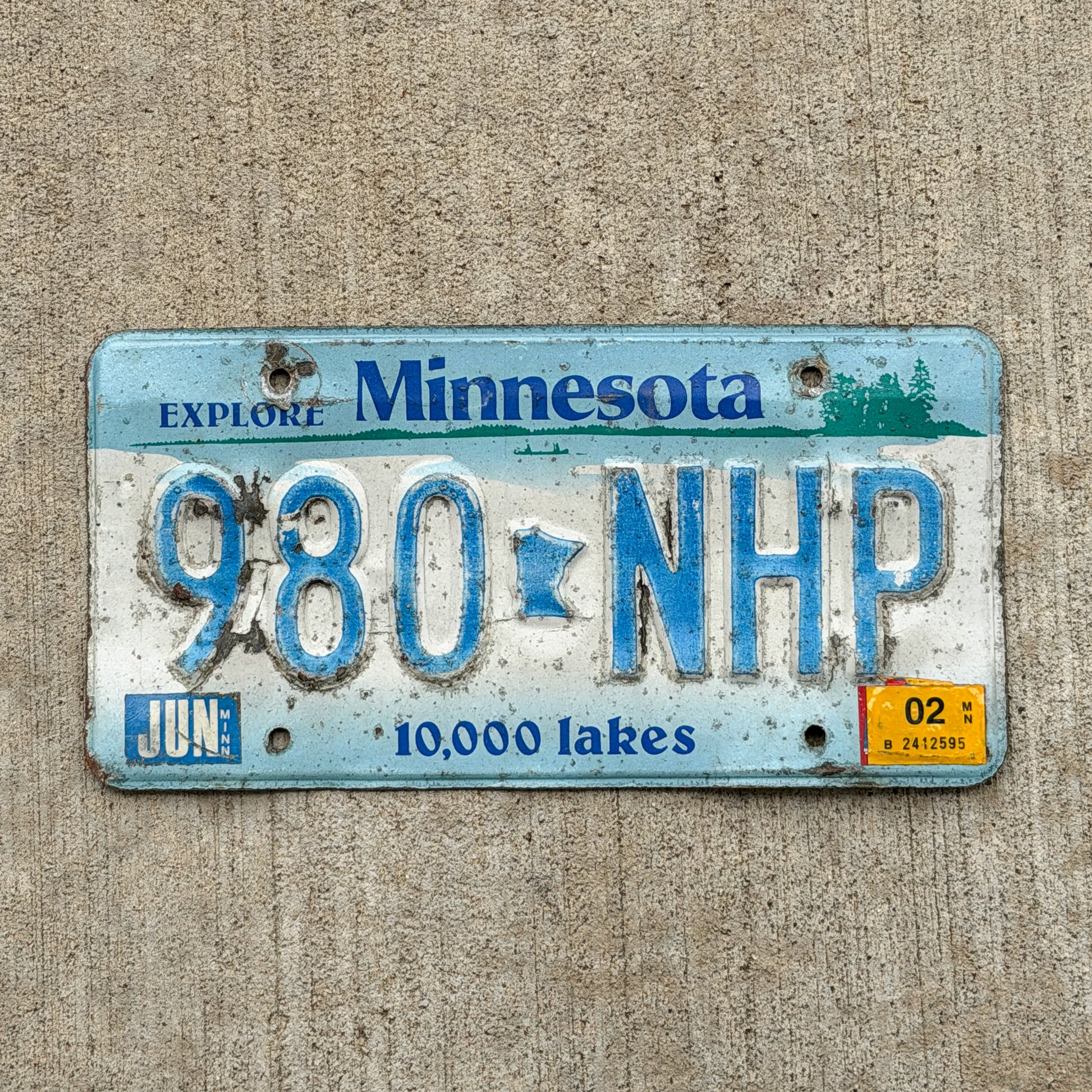 Photo of a 1994 2002 Minnesota License Plate Auto Tag Garage Decor Vintage 980 NHP with original patina