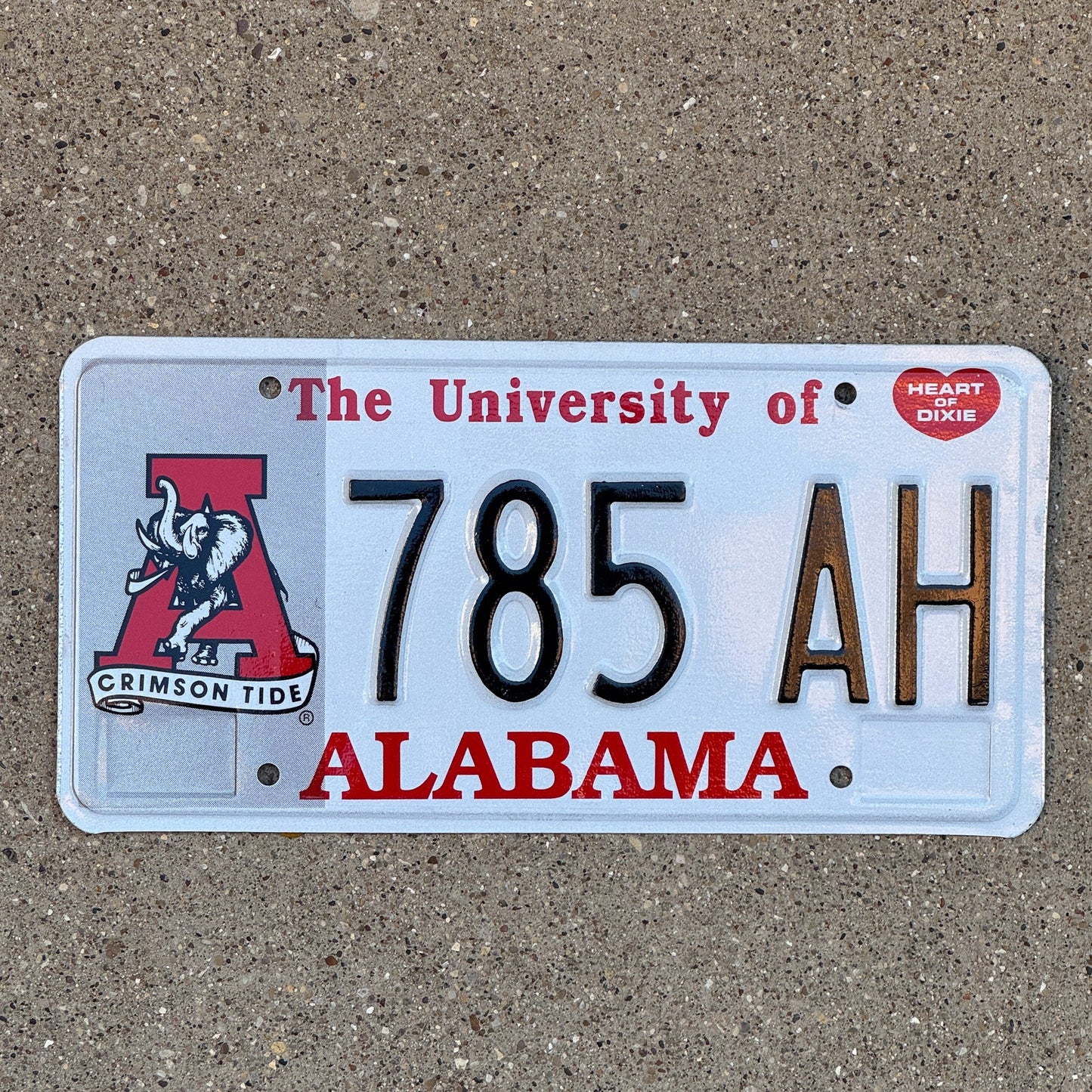 Photo of a 1994 Alabama Graphic / Specialty License Plate Auto Tag Garage Decor Vintage University of Alabama 785 AH with original patina