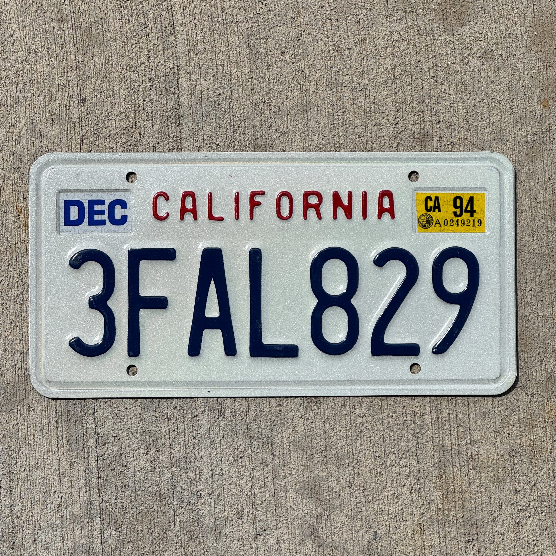 Photo of a 1994 California License Plate Auto Tag Garage Decor Vintage 3 FAL 829 with original patina