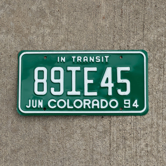 Photo of a 1994 Colorado In Transit Dealer License Plate Auto Tag Garage Decor Vintage 89 IE 45 with original patina