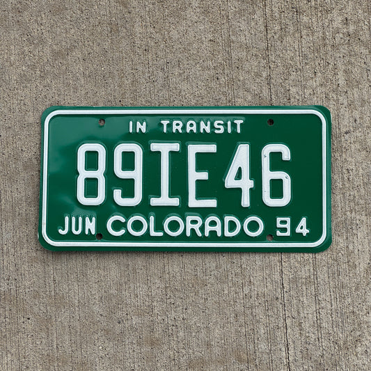 Photo of a 1994 Colorado In Transit Dealer License Plate Auto Tag Garage Decor Vintage 89 IE 46 with original patina