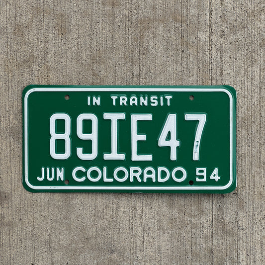 Photo of a 1994 Colorado In Transit Dealer License Plate Auto Tag Garage Decor Vintage 89 IE 47 with original patina
