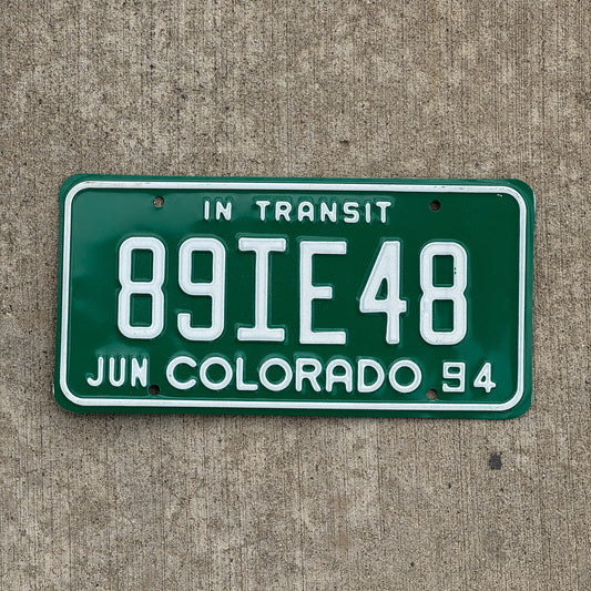 Photo of a 1994 Colorado In Transit Dealer License Plate Auto Tag Garage Decor Vintage 89 IE 48 with original patina