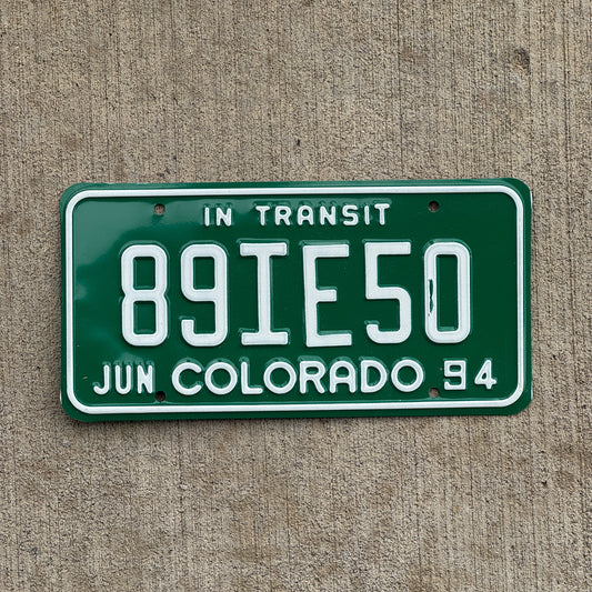 Photo of a 1994 Colorado In Transit Dealer License Plate Auto Tag Garage Decor Vintage 89 IE 50 with original patina