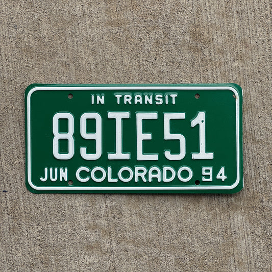Photo of a 1994 Colorado In Transit Dealer License Plate Auto Tag Garage Decor Vintage 89 IE 51 with original patina